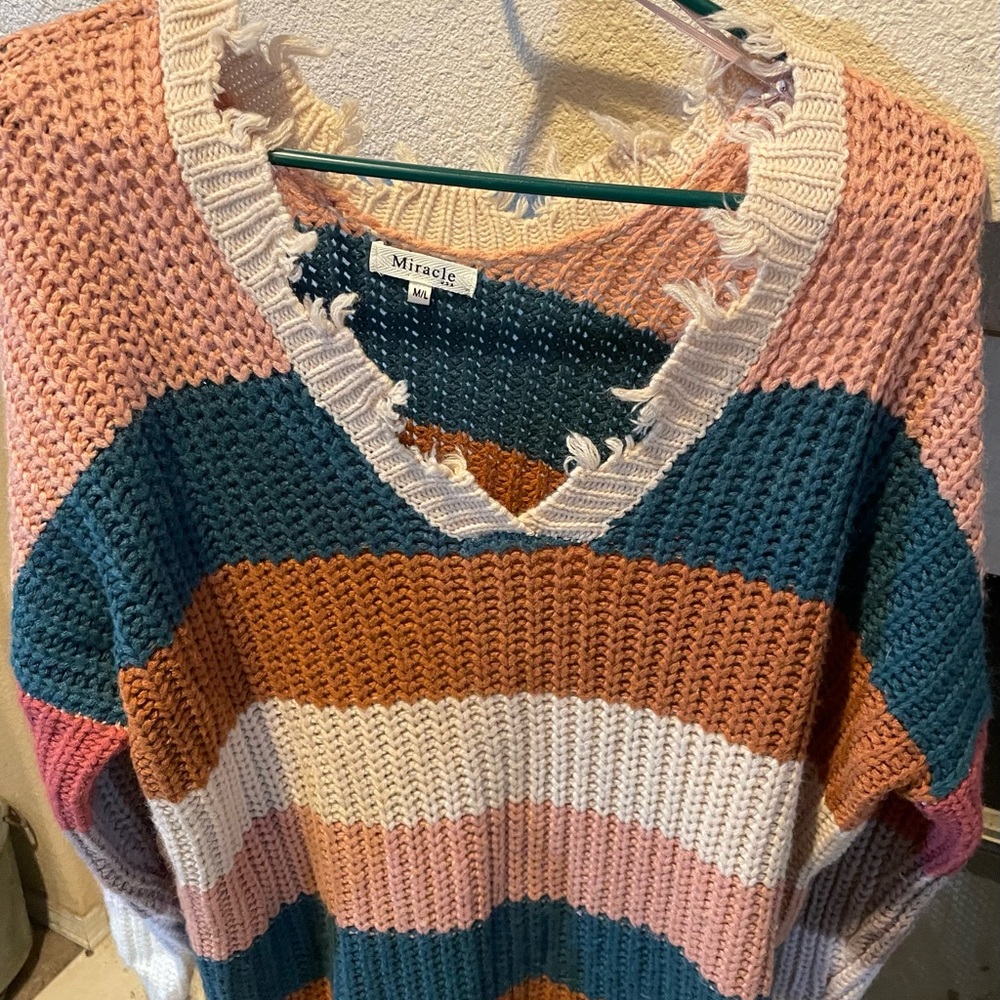 Colorful stripped sweater. Bought from a boutique and only worn once.